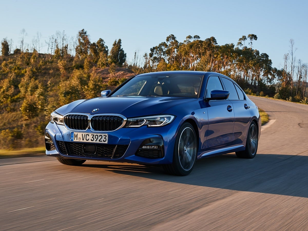2025 BMW 330i M Sport Portimao Blue Metallic Front Quarter View Action