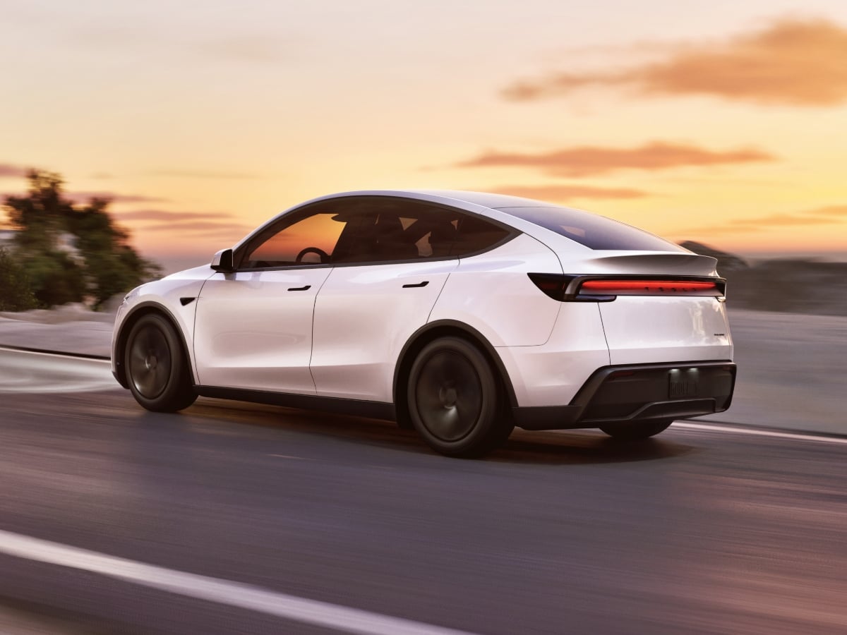 2026 Tesla Model Y White Rear Quarter View Action