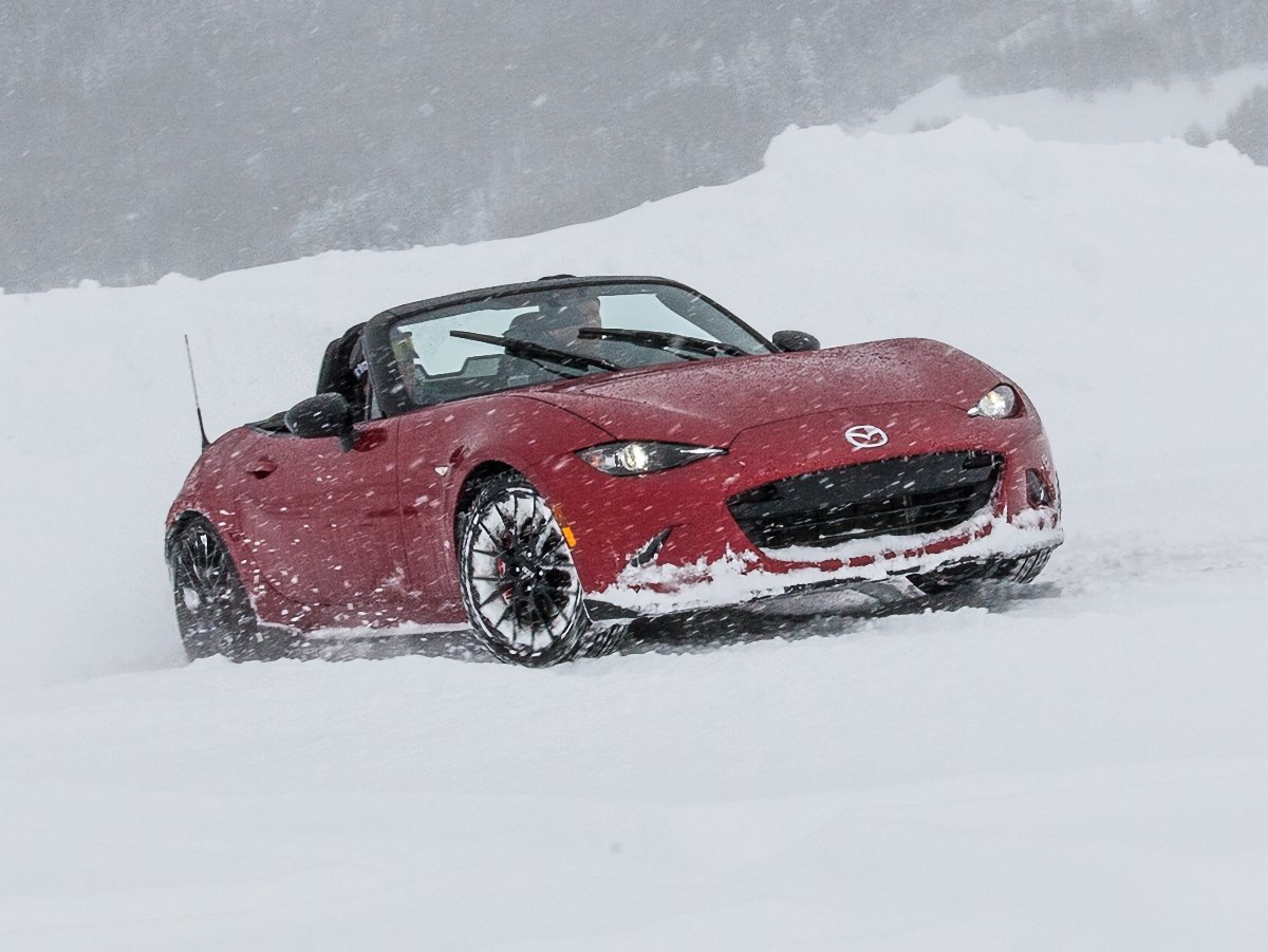 Mazda Miata driving in snow